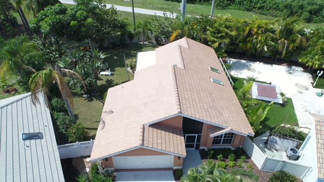 An aerial view of a house with a tiled roof