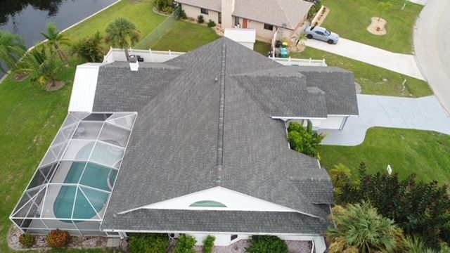 An aerial view of a house with a swimming pool