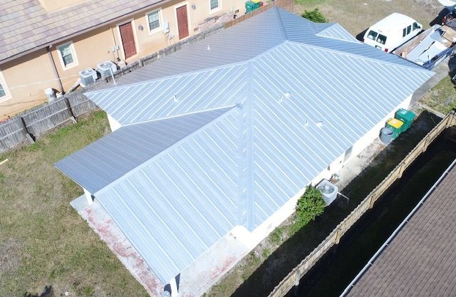 An aerial view of a house with a metal roof.