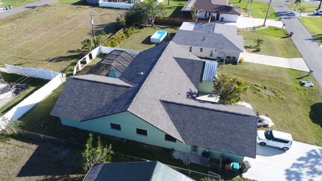 An aerial view of a house in a residential area