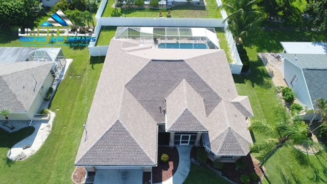An aerial view of a house with a large roof