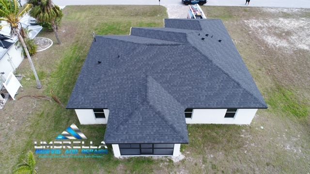 An aerial view of a house with a new roof.