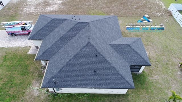 An aerial view of a house with a new roof.