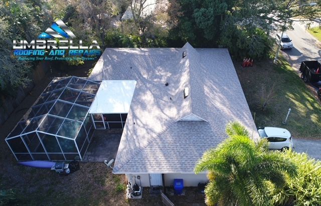 An aerial view of a house with a screened in porch.