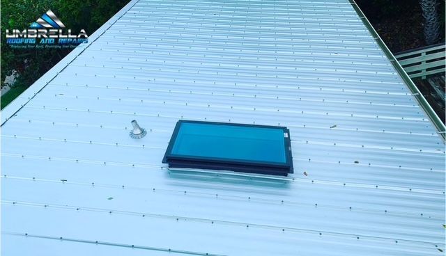 A roof with a skylight on top of it