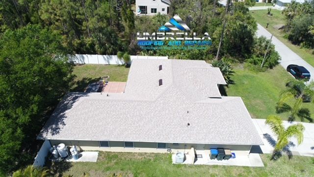 An aerial view of a house with the word umbrella on the roof