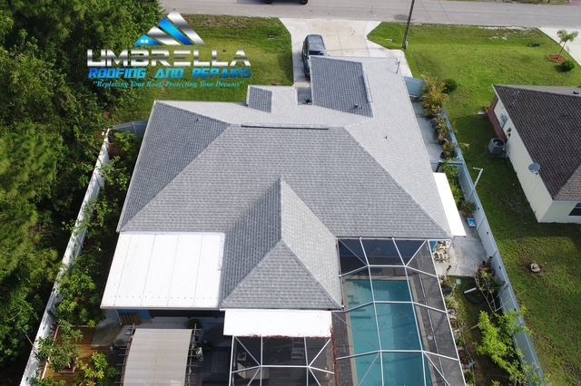 An aerial view of a house with a swimming pool