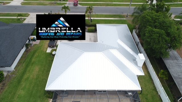 An aerial view of a house with a sign that says umbrella
