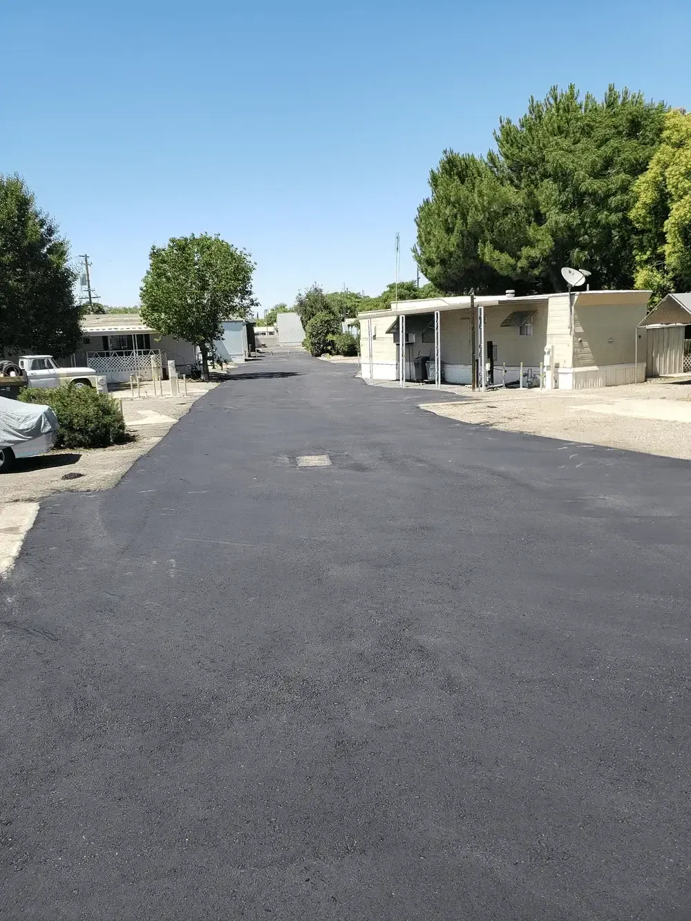 A road with a lot of houses on the side of it