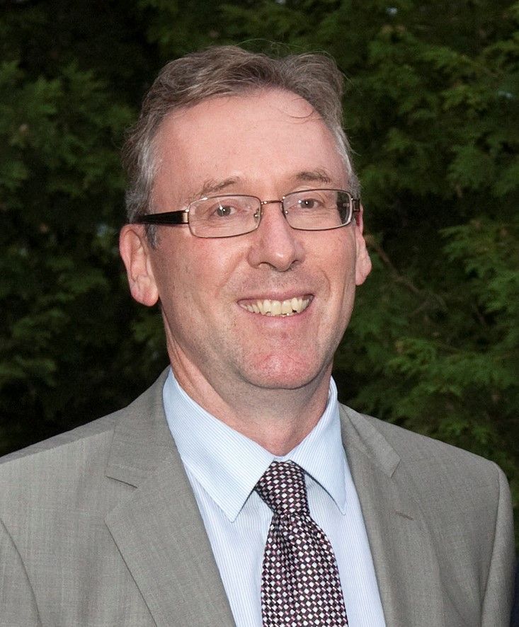 The logo for united way leeds and grenville is a red hand holding a compass.