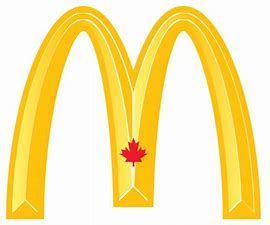 A yellow mcdonald 's logo with a red maple leaf on it