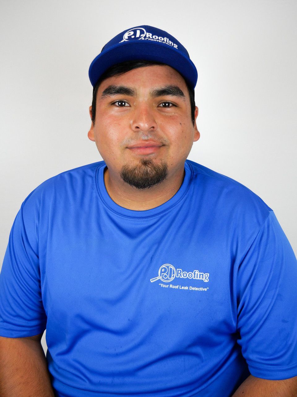 A man wearing a blue shirt with the word heating on it