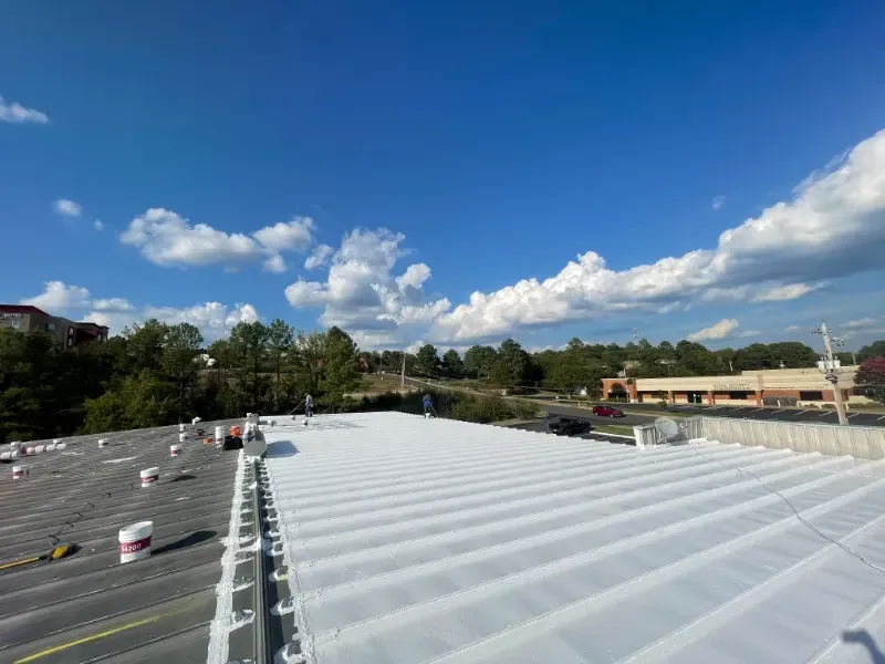 A white roof with a blue sky in the background.