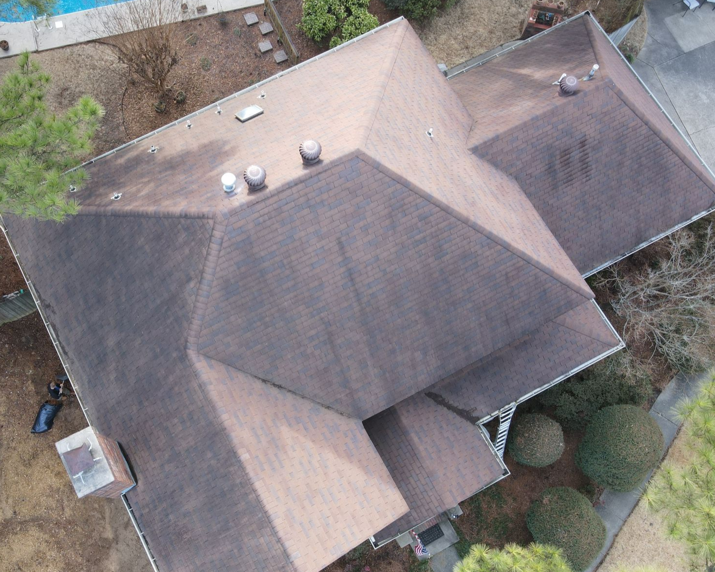 A house with a large lawn in front of it