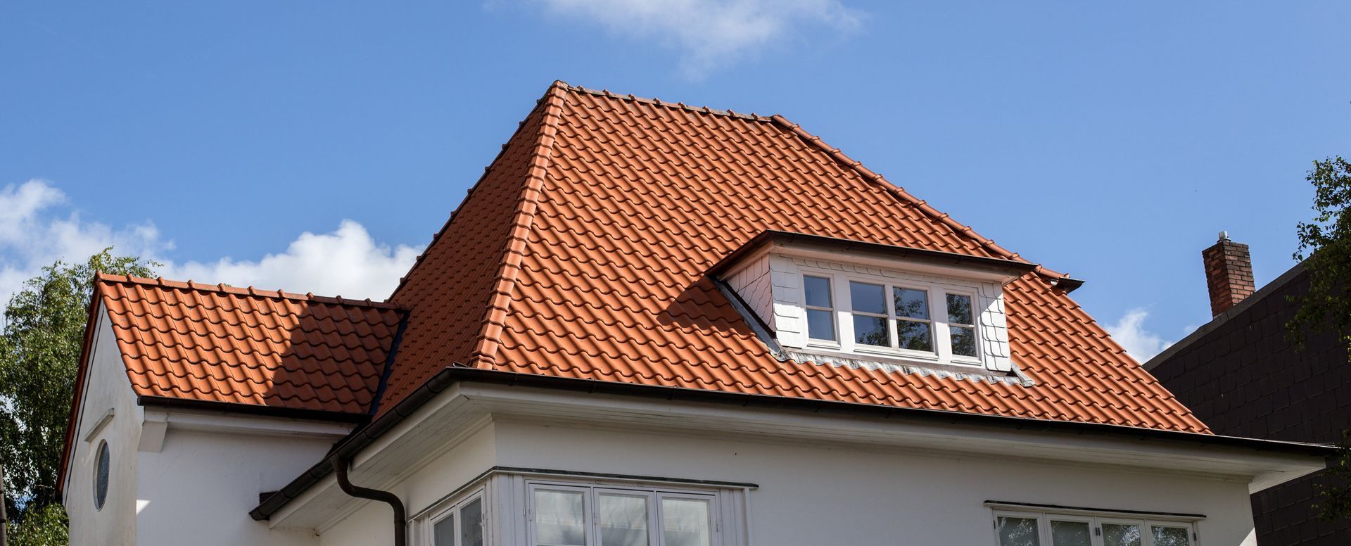 view of a red tile roof