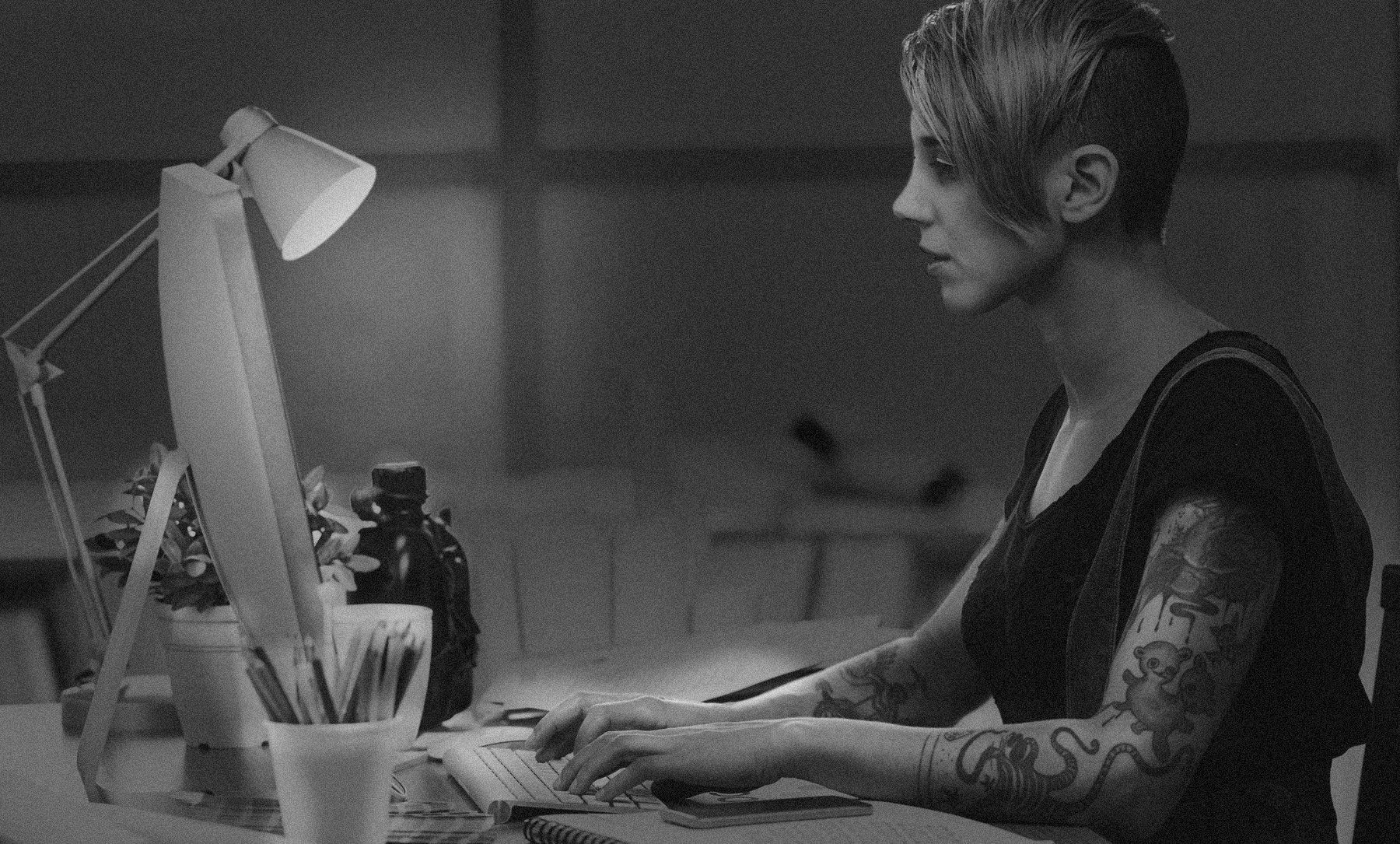 Artist designing digitally on a computer.