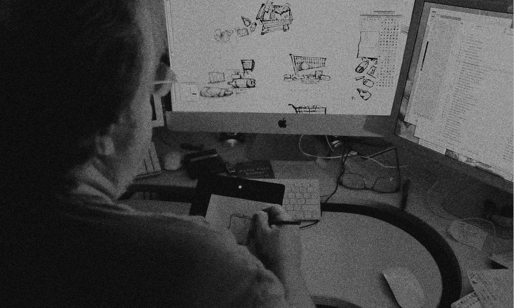 Artist designing digitally on a computer.