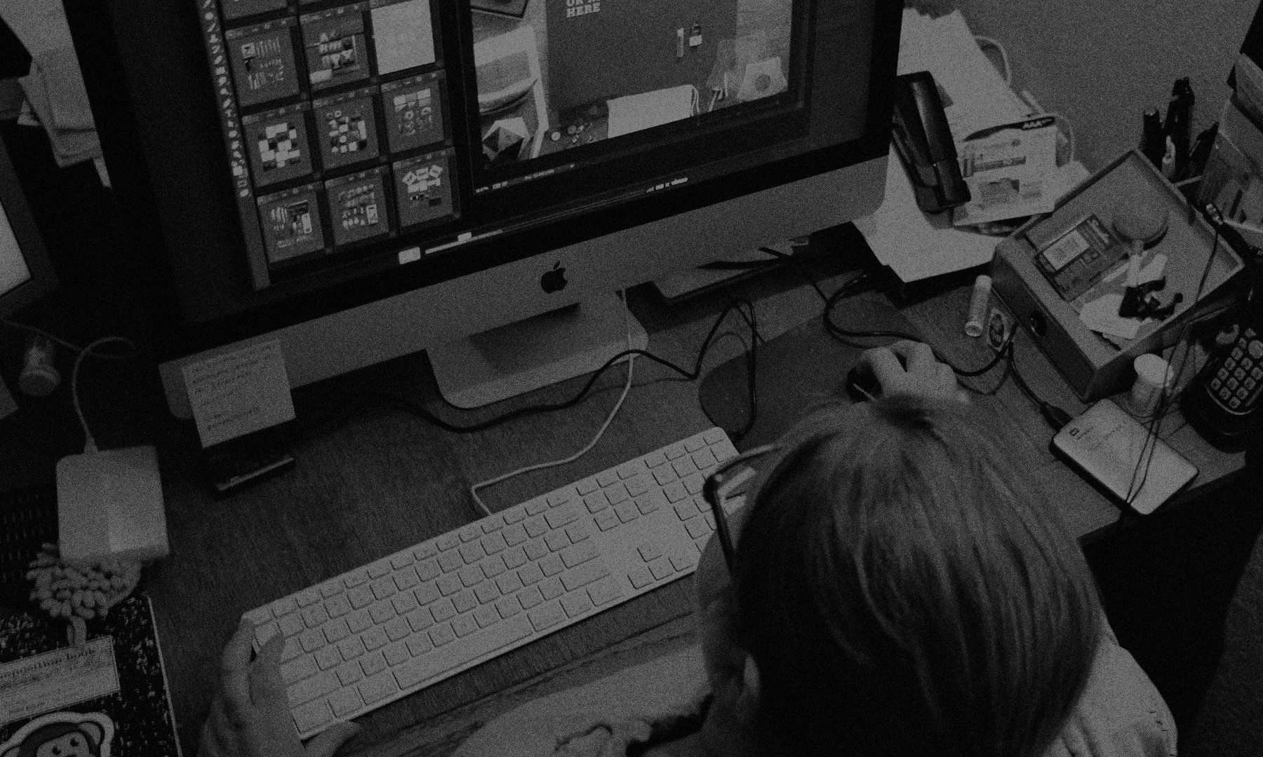 Overhead view of artist designing on a computer.