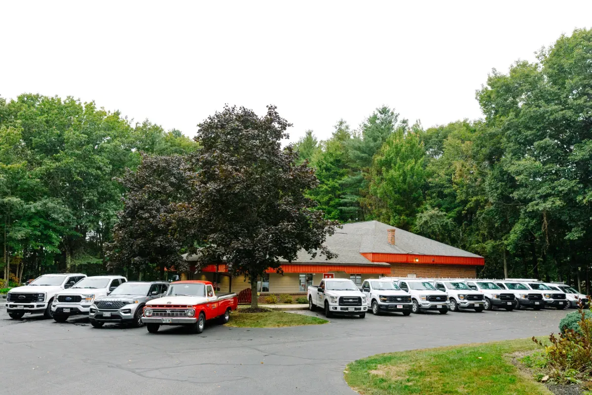 Work trucks parked outside of the warehouse
