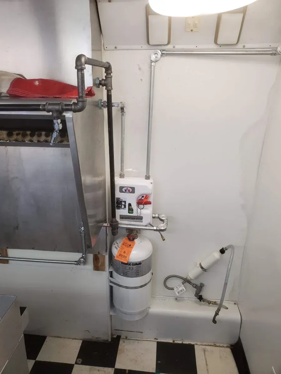 A bathroom with a checkered floor and white walls