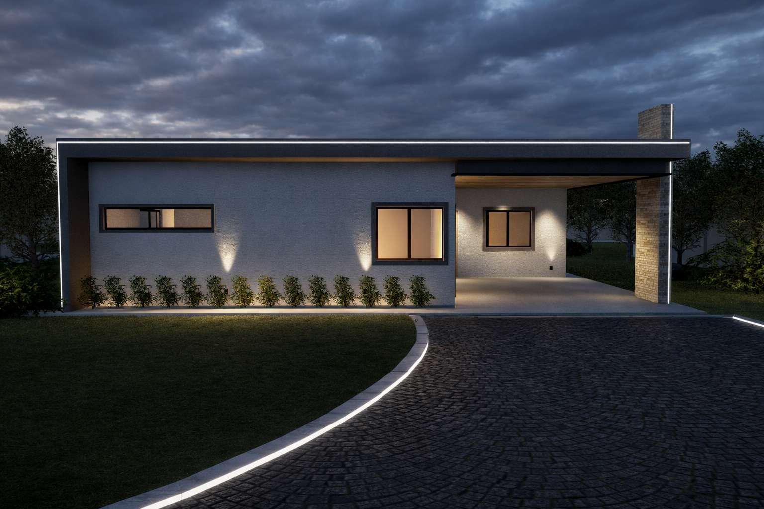 Casa moderna de una sola planta al anochecer, con ventanas iluminadas, iluminación exterior de acento, un pilar de piedra