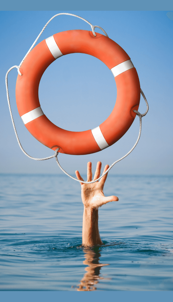 Hand reaching out of water for a life preserver hanging in the air