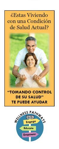A  man and woman outside smiling and holding hands.