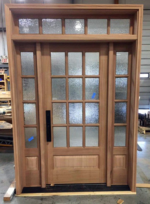 12 light triple door unit with 5 lite transom features hammered glass