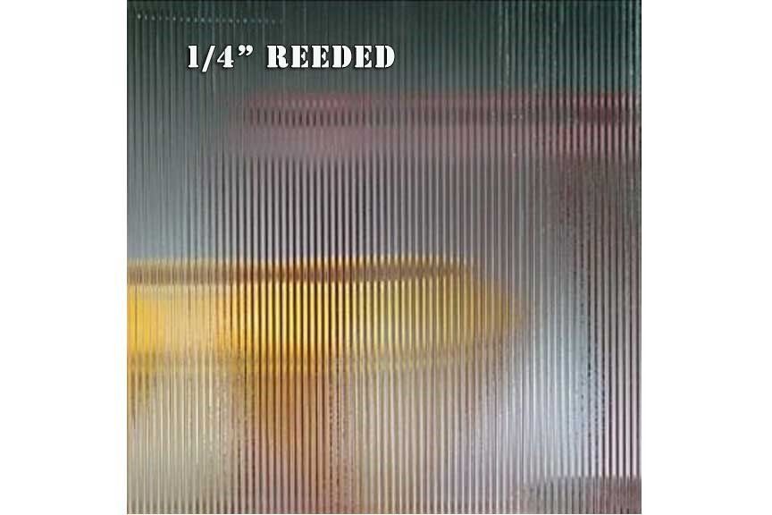 A picture of a reeded glass with a yellow object in the background.
