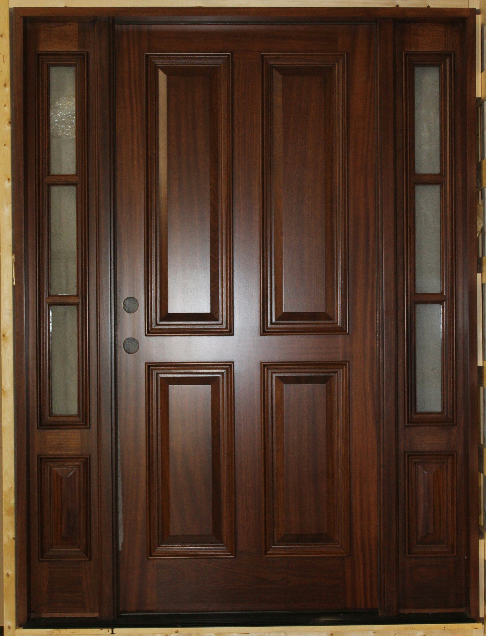 A wooden door with a lot of windows on it
