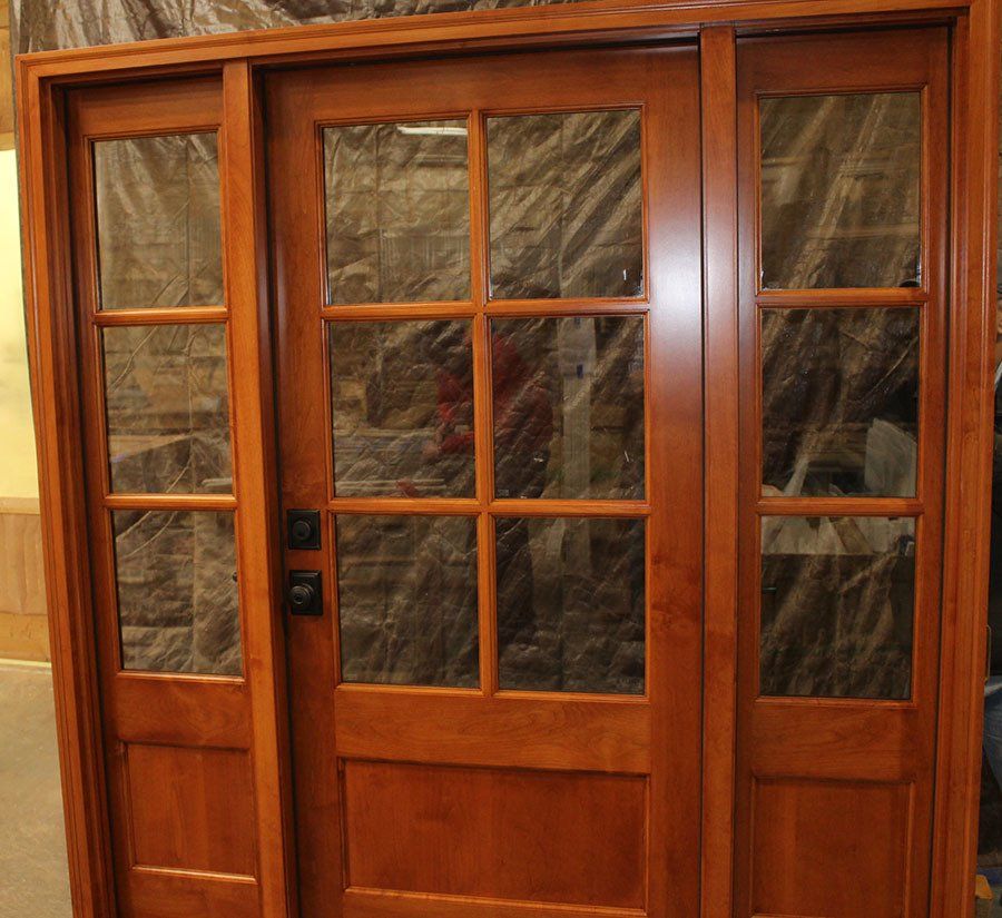 Alder wood front door with 6 lites and operating sidelights factory finished
