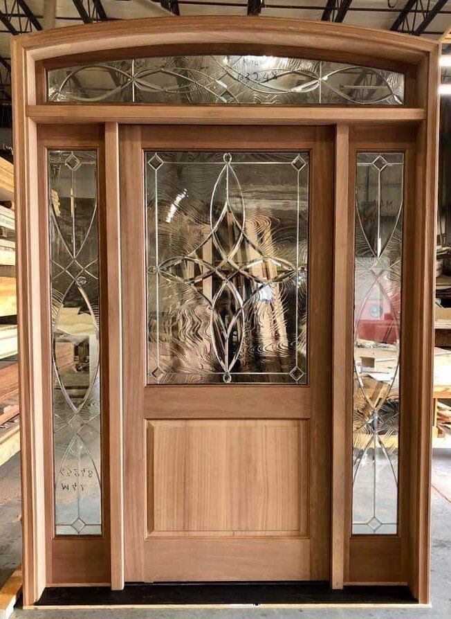 Mahogany halflite with decorative glass, matching sidelights and eyebrow top transom unit