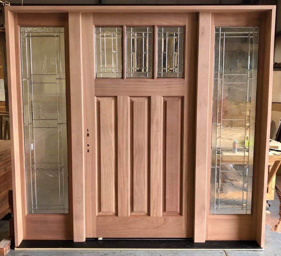 Mahogany wood door with decorative glass side lights
