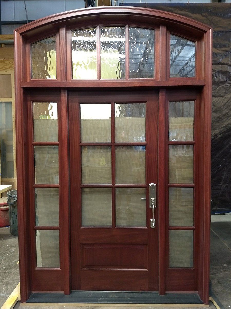 Mahogany entry door with sidelites and arched transom