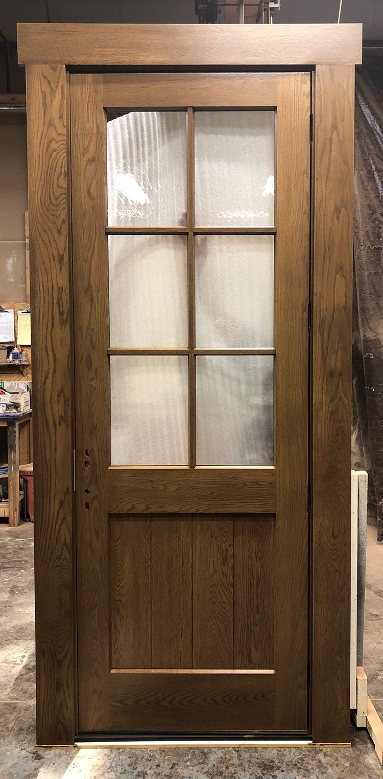 Single pre-hung 6 lite White oak, and antique glass Custom color factory finish