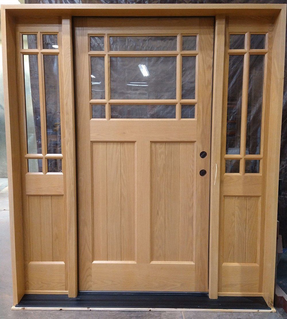 Unique third lite door with sidelites made from red oak