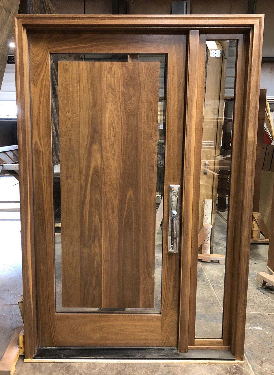 Walnut wood door with floating panel and sidelite