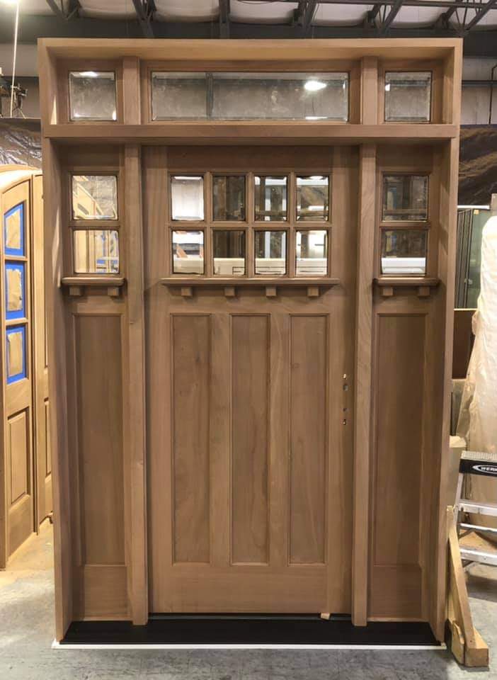 Craftsman mahogany entry door with side lites and transom