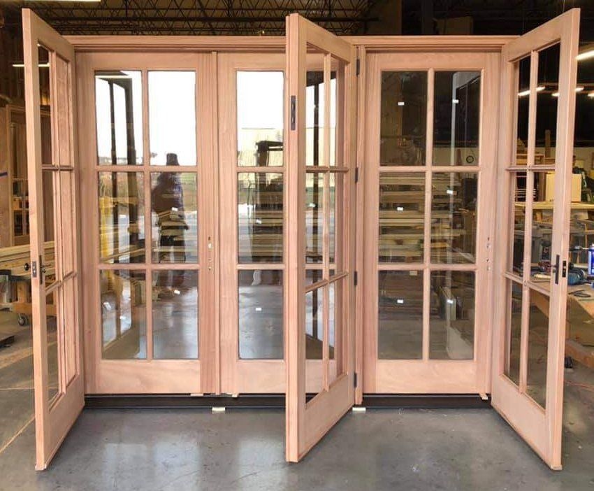 A set of french doors are open in a room
