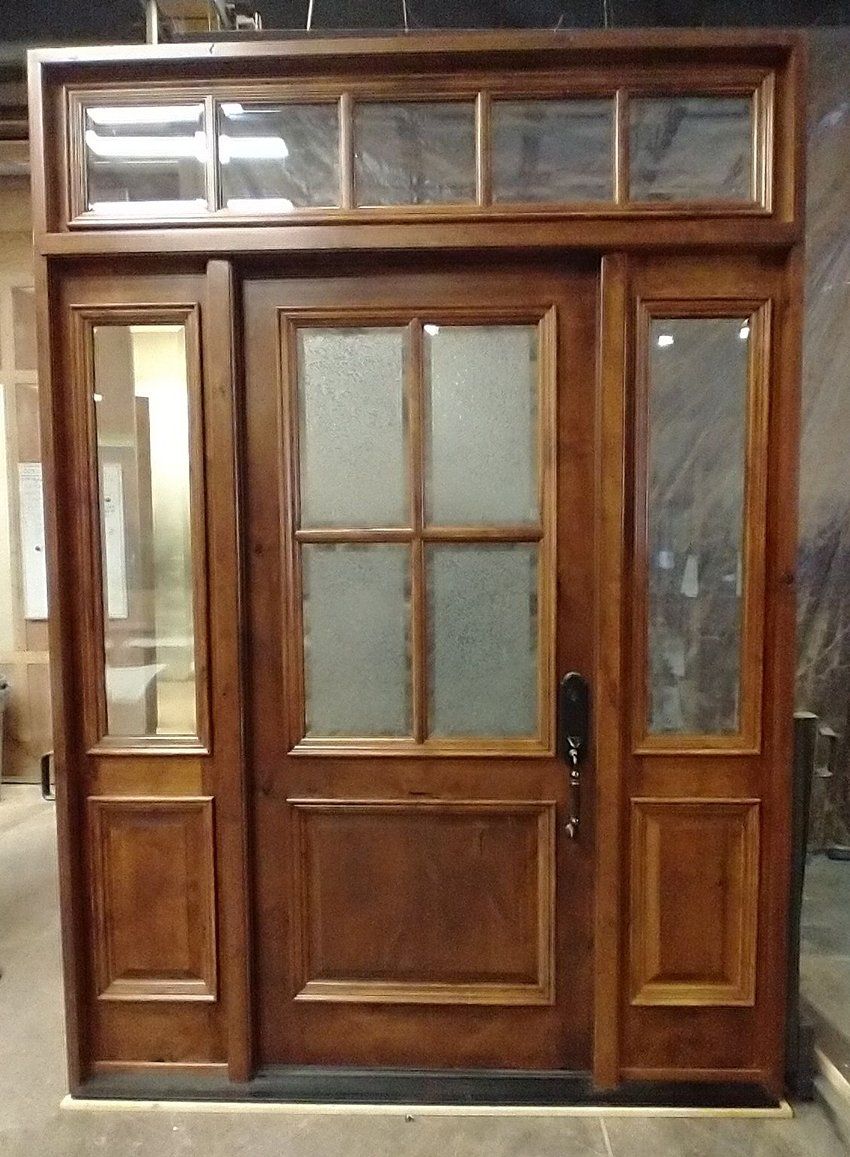 Knotty Alder door with Glue chip beveled glass in door and clear IG in sidelites and transom.  Factory finished in Saddle.