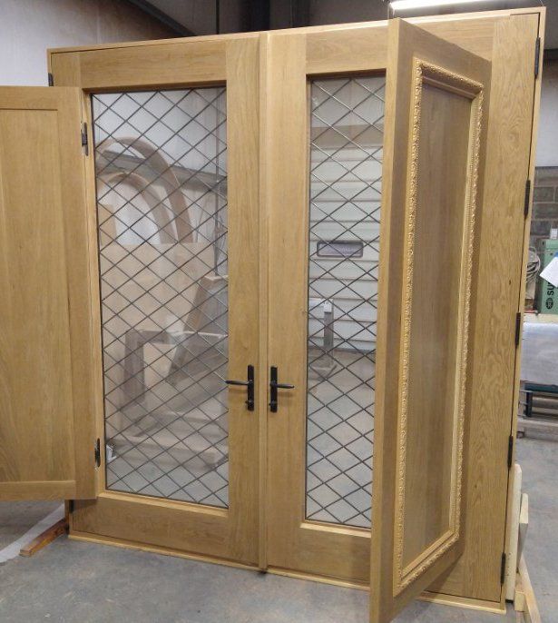 A wooden door with a mesh screen on it