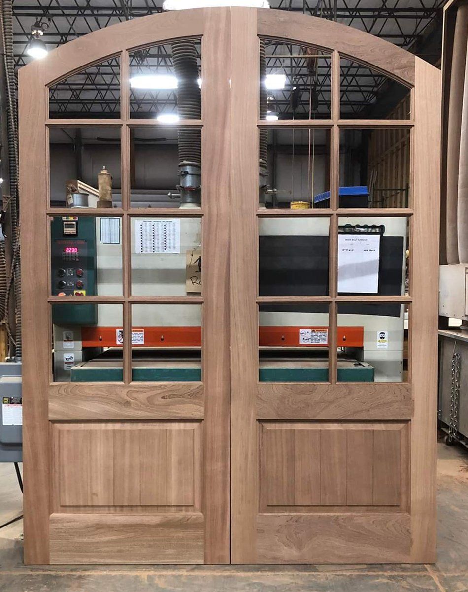 Eyebrow arched double door unit in mahogany