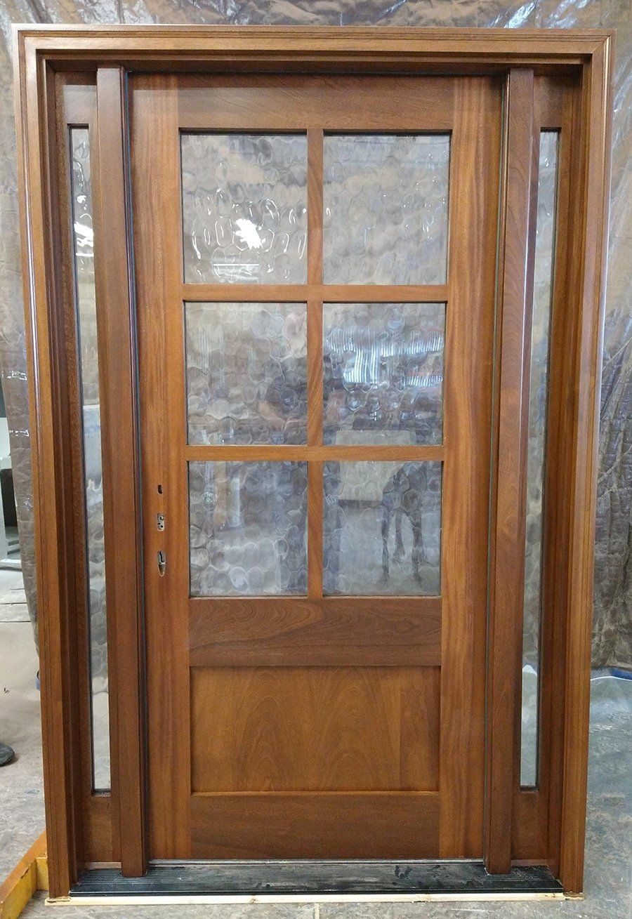 Mahogany entry door with narrow sidelites
