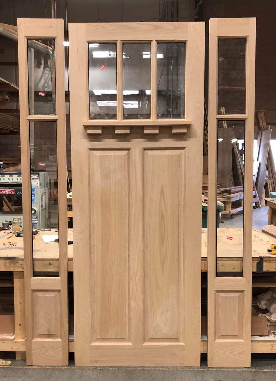 Red Oak craftsman entry door with sidelights