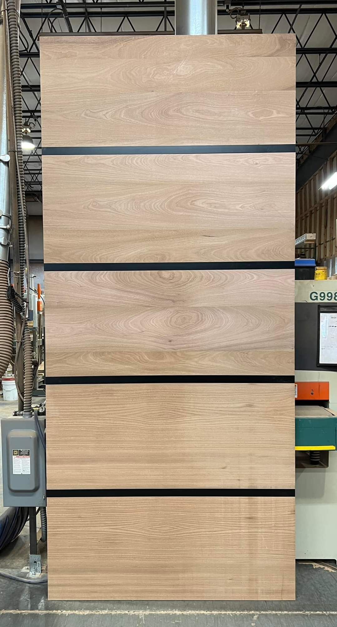 Paint grade Sapele Mahogany flush door with inlayed black powder coated metal straps