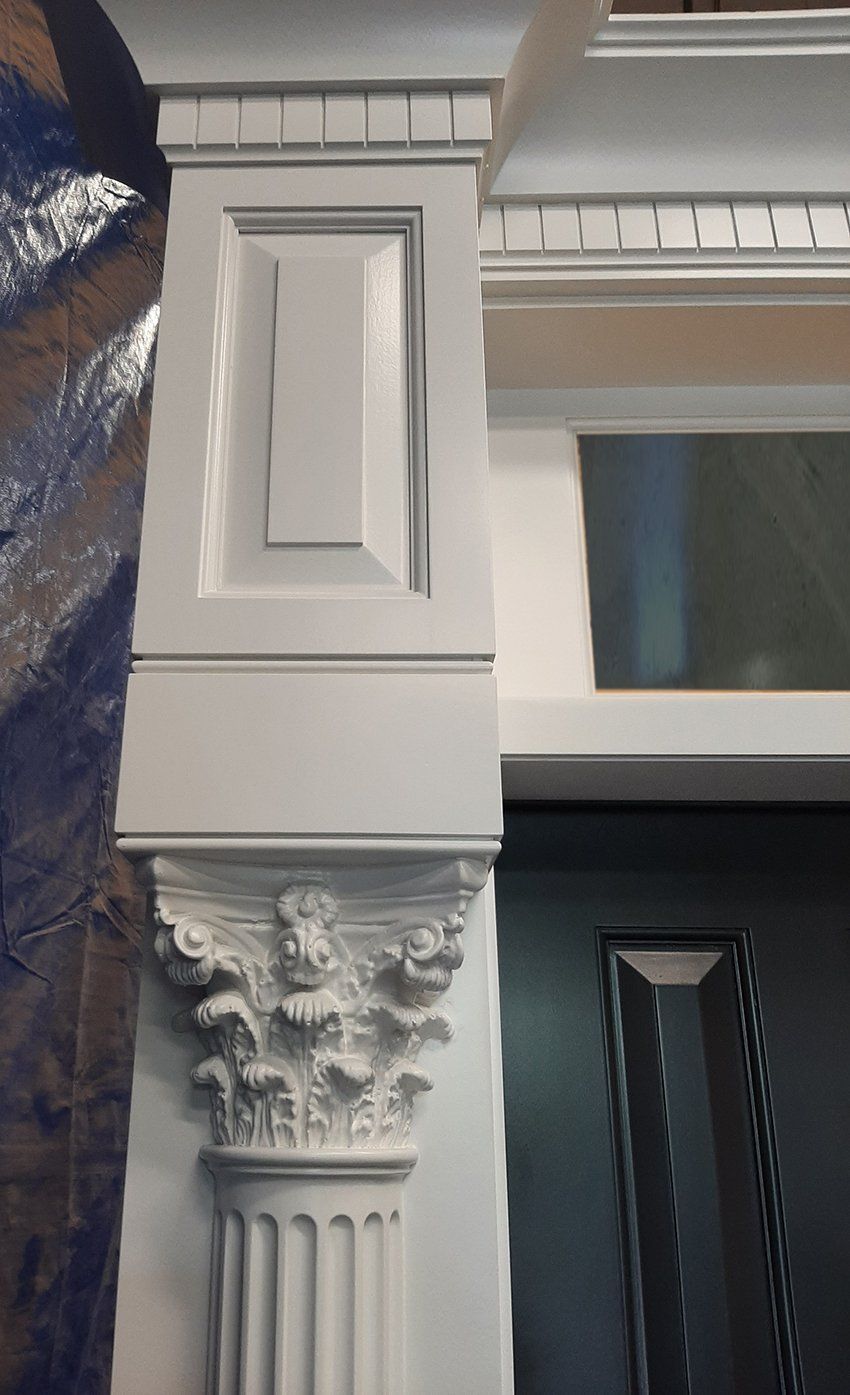 A white column with a crown on top of it