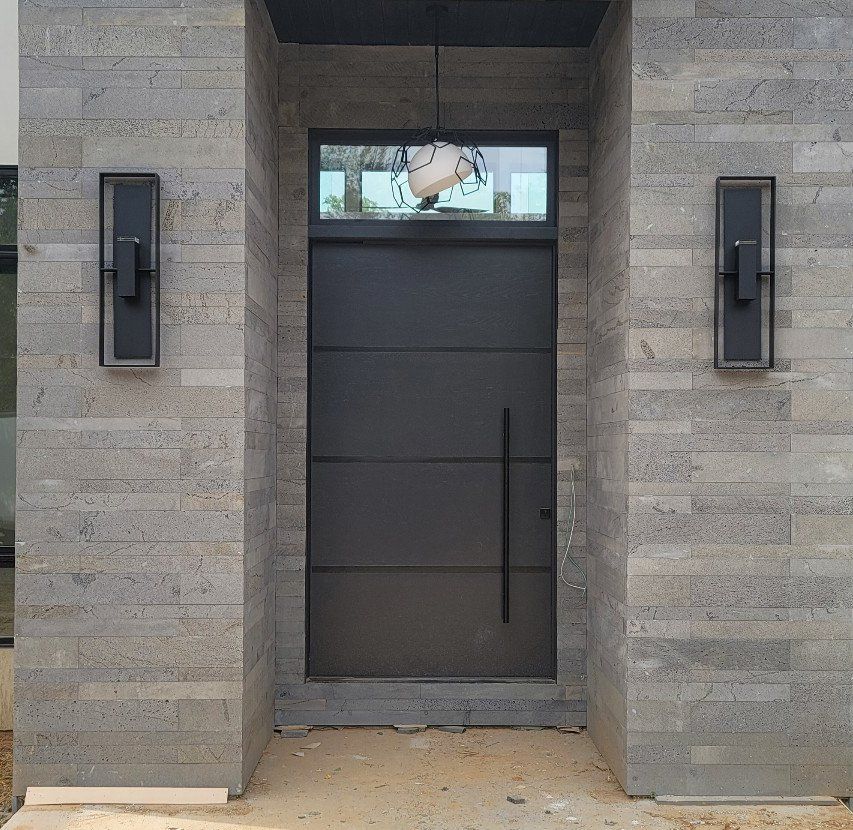 Tulacro pivot door White Oak with black metal inlays Painted Benjamin Moore Black Iron