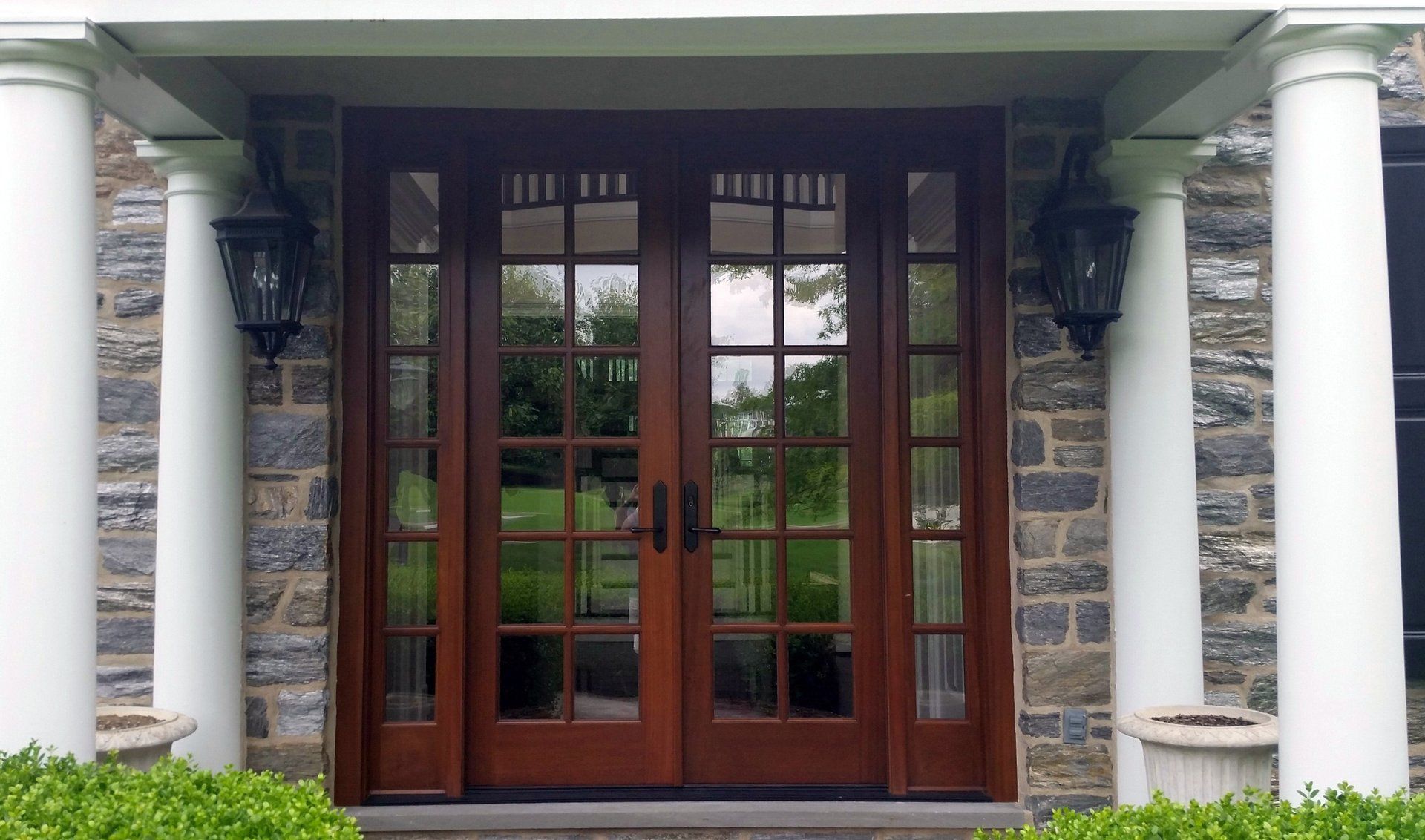 The front door of a stone house with a wooden door