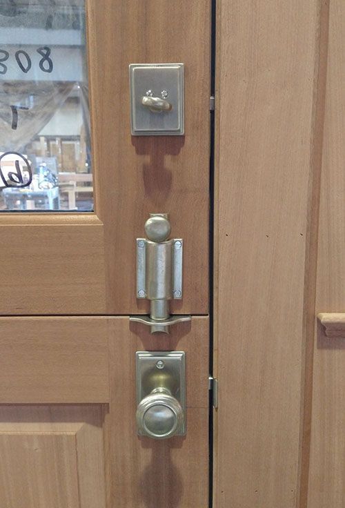 A close up of a wooden door with a lock on it.