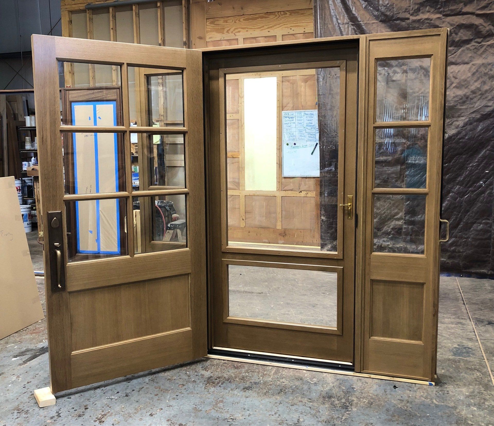 A set of wooden doors with a window in the middle